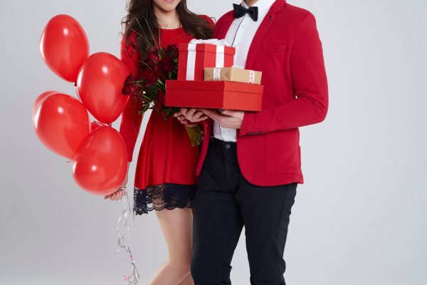 Handsome young man delighting his woman with gifts