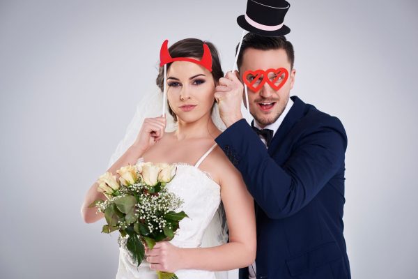 Young marriage with funny accessories