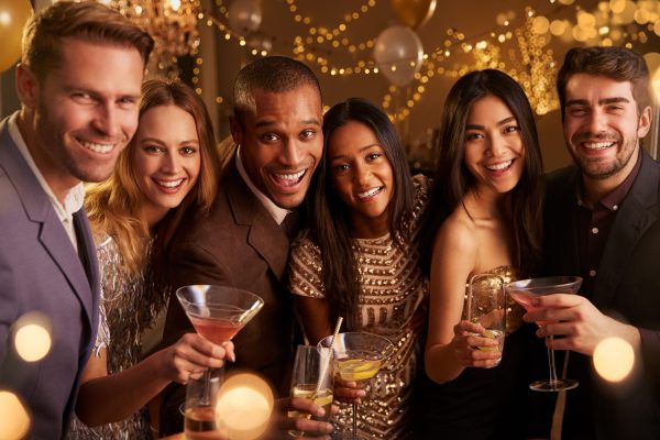 Portrait Of Friends With Drinks Enjoying Cocktail Party